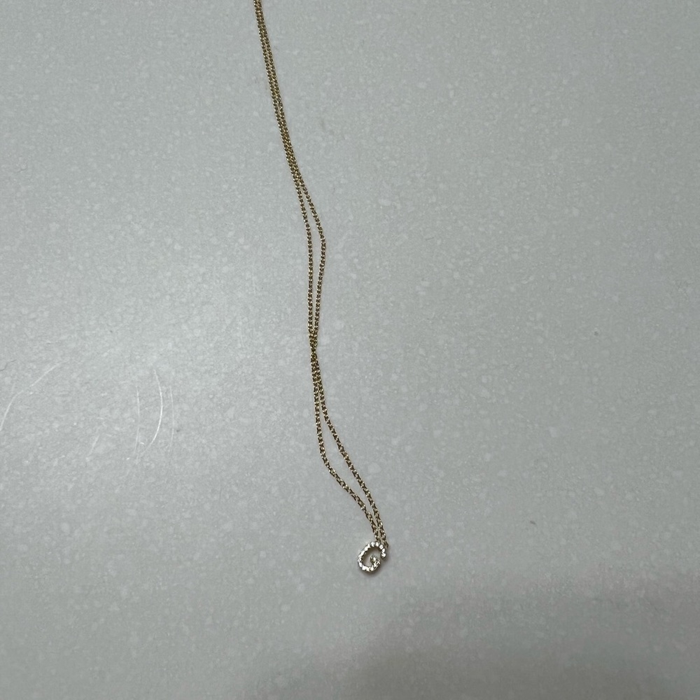 dainty gold G necklace